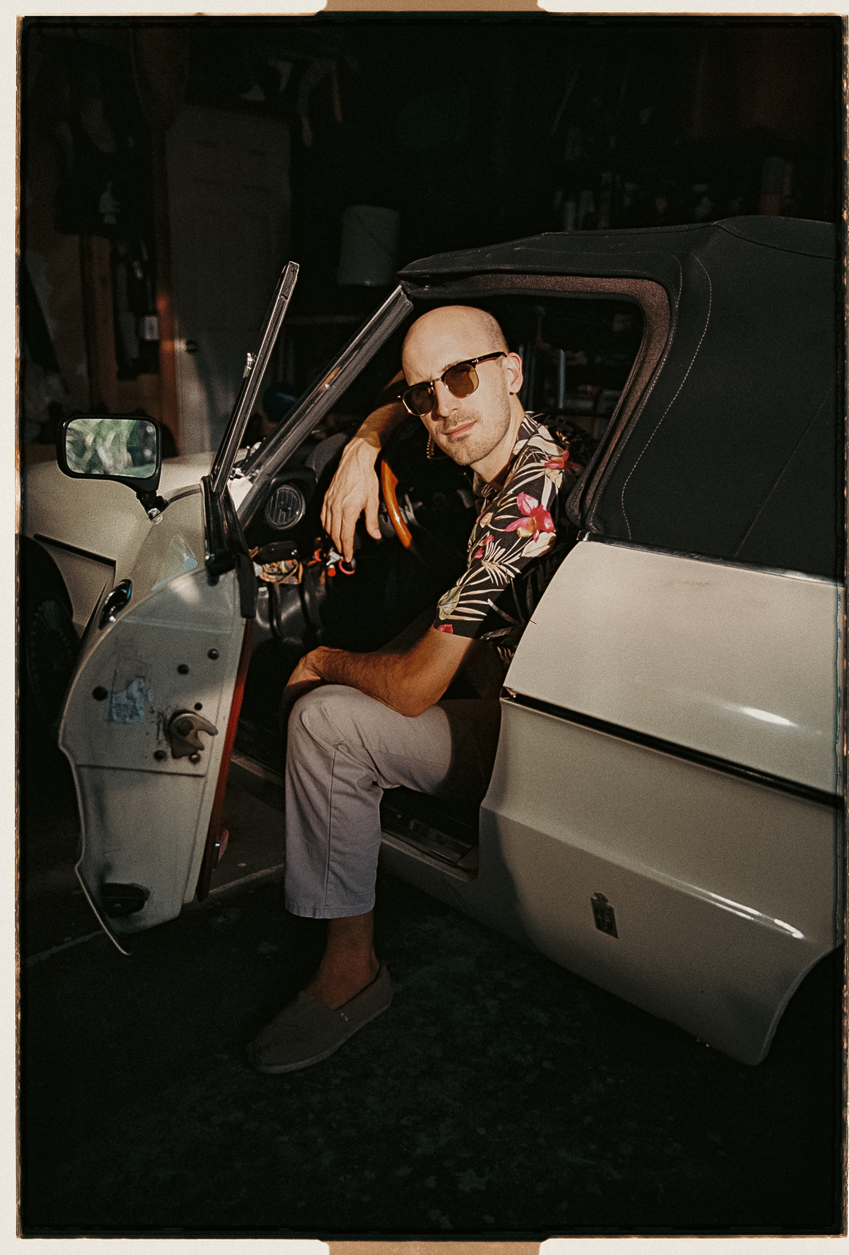 Mr. Mueller posing in 1970s convertible